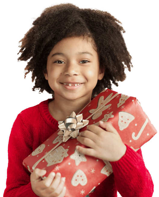 Happy child holding a present to give to family