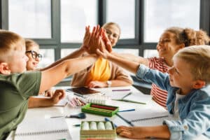 Elementary Students High Fiving