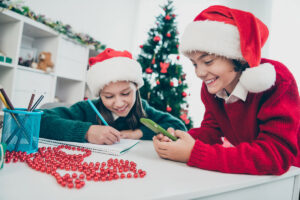 Children Making A List While Using A Phone